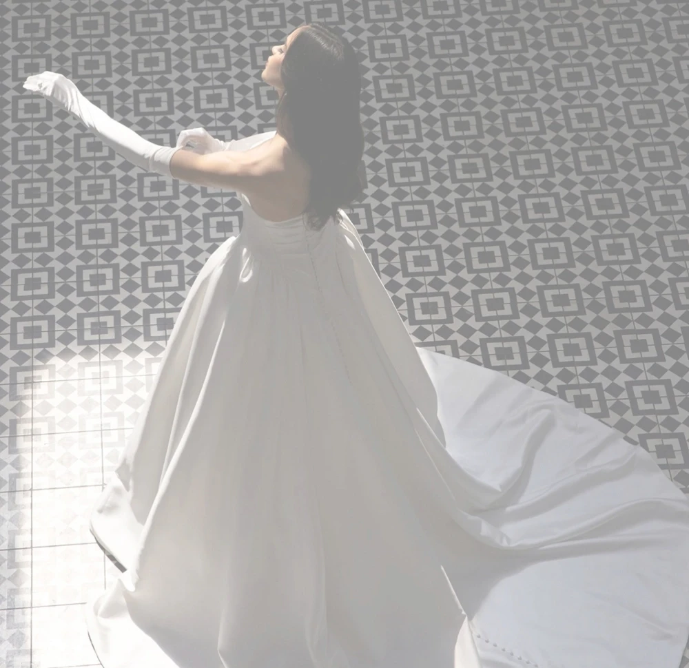 Model Wearing a bridal gown by Essense of Australia